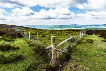 View on a fence with mountains in the background