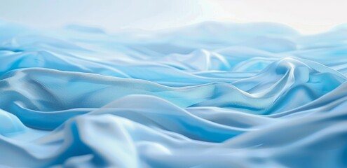 Obraz premium Soft, flowing waves of blue fabric cascade across a surface, creating a sense of movement and tranquility.