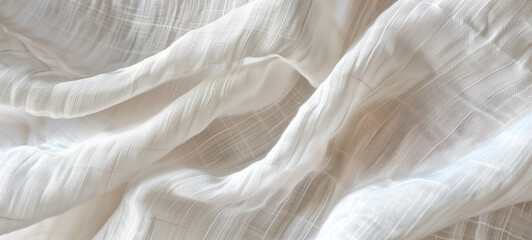 Obraz premium A delicate texture of white linen fabric with subtle folds
