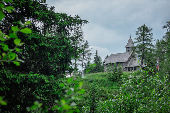 Pramollo memorial church, a small heritage church close to nassfeld or pramollo lake on high alpine pass between italy and austria. Cold summer day with clouds.