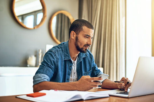 Online, laptop and man in living room with remote work for report, review or update article. Technology, journalist and freelancer for confirm source, proofreading or working on feature story in home