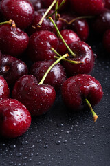 Lot of red ripe cherries close up with water drops. Large collection of fresh red cherries. Ripe cherries background.