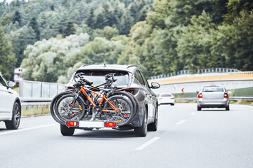 Vehicle transporting bicycles on road