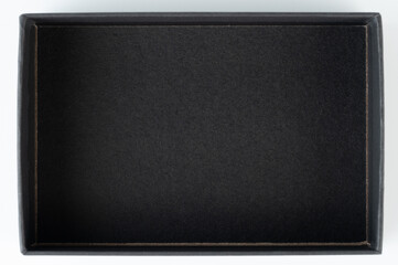Fototapeta premium Black paper box above top view