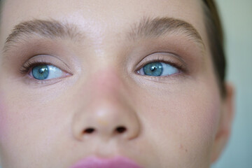 Close-up of a caucasian woman with blue eyes