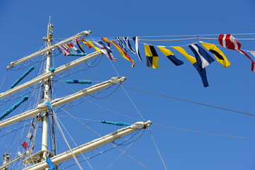 close-up view of the intricate rigging, masts, and sails of a tall ship © Mikhail Olykainen