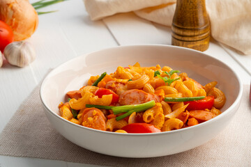 Stir Fried elbow Macaroni with sausage ,tomatoes ,carrot and egg in Tomato Sauce.fusion food