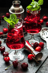 Fresh   cherry  drink with    mint green leaves, selective focus