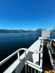 A beautiful view of a vast body of water with towering mountains in the distance