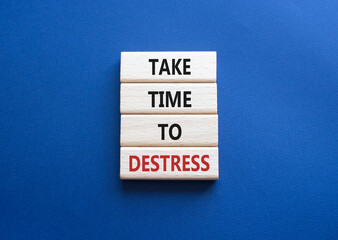 Take time to Destress symbol. Wooden blocks with words Take time to Destress. Beautiful deep blue background. Business and Take time to Destress concept. Copy space.