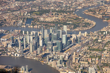 High aerial view of downtown city of London, with river Thames, the Shard, Tower bridge, HMS Belfast and may buildings, squares, offices. embankment, taken from airplane