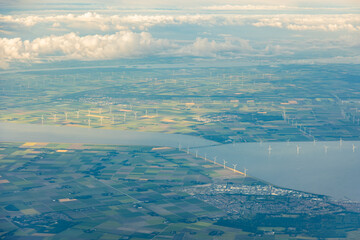 Aerial airplane view across the British Channel en the Thames estuary, delta, where the river meets the North Sea with Southend, Chatham and London. Many ships, yachts and marine industry