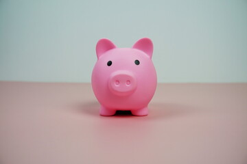 piggy bank for saving money with space for text on pink background