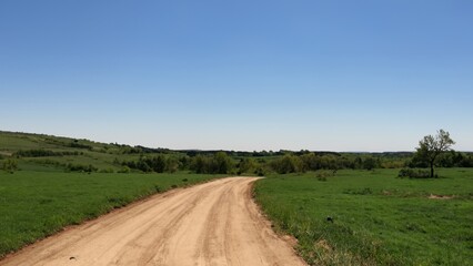 Landscape field road blue sky