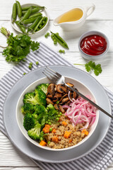 quinoa with veggies and mushrooms in a bowl