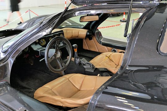 Side view and interior of project car Laser 917, inspired by Porsche 917 and based on VW Beetle chassis, with opened gullwing doors. Displayed on car and tuning expo in Nitra, Slovakia, june 2024
