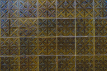 Ceramic square tiles with small ornamental mosaic pieces. Old tiles abstract pattern