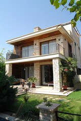 Fototapeta premium Contemporary cubic house with white walls and light wood cladding in a picturesque green meadow