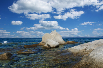 Beautiful greek landscape with colorful sky, sea and rock