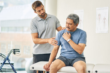 Physiotherapist, senior man and shoulder pain for support, elderly care and wellness for health or fitness. Pensioner, male person and medic for appointment, rehabilitation clinic or retirement home