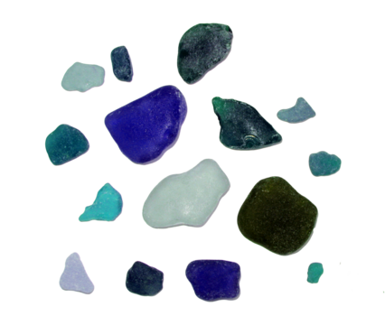 Collection of smooth, colorful sea glass pieces are scattered on transparent background. Sea glass is of various sizes and shapes, and includes colors such as blue, green, purple and white.