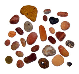 Multicolored smooth sea stones, pebbles, isolated on transparent close-up, design element 