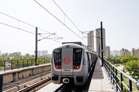 Delhi metro and the metro station. Metro rail in delhi. Dmrc metro entering the station.  Indian Subway Train.