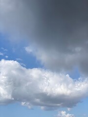 Obraz premium White clouds on the bright blue clean sky