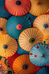 A vibrant and playful display of colorful umbrellas suspended from the ceiling, perfect for adding a pop of color to any room or event