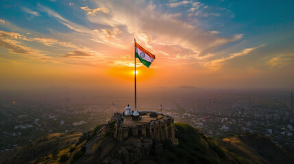 Aerial View of Indian Flag on Hilltop with Cityscape Background, 26 January, Republic Day, Independence Day, 15th August.