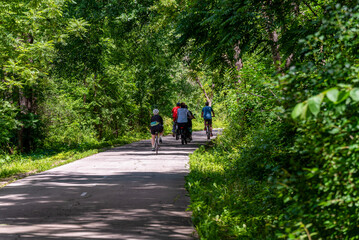 People On Bicycles On The Fox River Trail Near De Pere, Wisconsin, In Summer