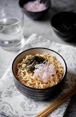 Ramen noodles with seaweed and radish in a bowl