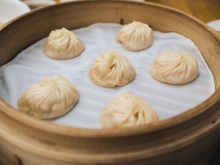 Freshly Steamed Soup Dumplings in Bamboo Steamer - Traditional Chinese Delicacy