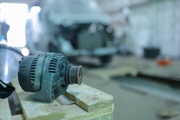 replacing a car generator at a car service center