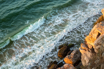 Seascape. the sea with waves and foam, a view from above, from the top of the cliff