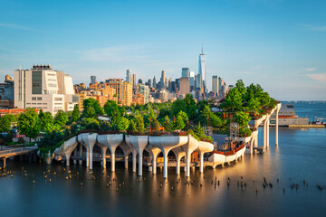 Long exposure of Little Island over the Hudson River in Chelsea, New York, with the lower Manhattan...