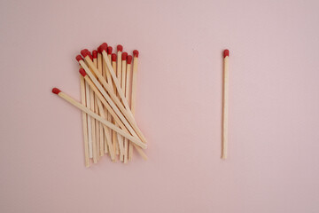 Box with new matchsticks on color background. Scattered wooden matches without a box close-up. Design
