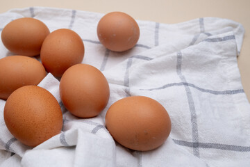 Chicken eggs. Bowl with raw eggs on the table. Natural organic farm product. Preparing for Easter. Delivery of fresh products. Raw ingredient for cooking
