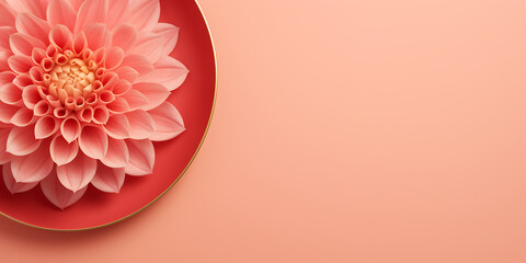 Naklejka premium A delicate pink flower on a red plate.