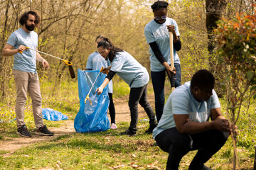 Citizens fixing pollution and illegal dumping by tidying the forest ecosystem, recycling plastic...