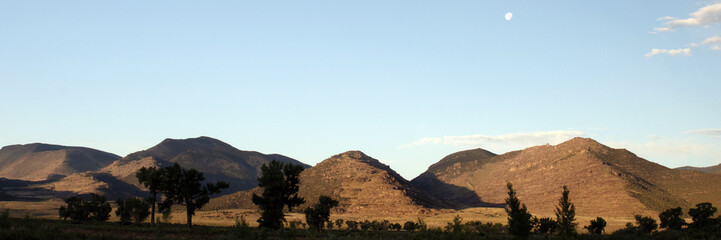 Ultrawide panorama of the landscape and the moon at Browns Park National Wildlife Refuge in Colorado