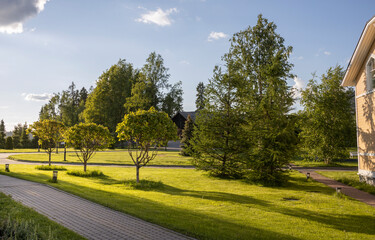 A peaceful park with a brick walkway and trees