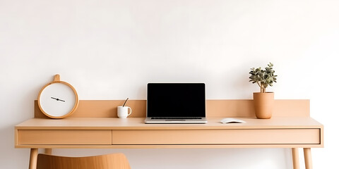 Minimalist wooden desk with laptop, clock, plant and coffee cup.