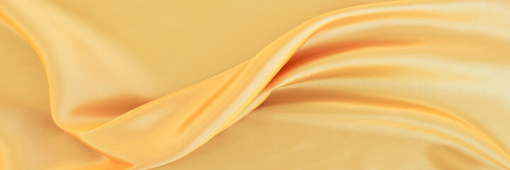 yellow gold satin texture that is white silver fabric luxurious shiny that is abstract silk cloth...