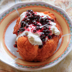 Europe, Romania, Viscri. Traditional dessert, Berry Cobbler with cream.