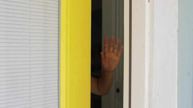 Hand blocking front door