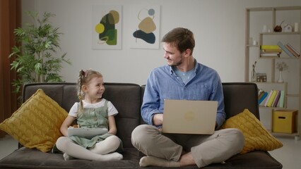 High Five: Celebratory Moment Between Father and Daughter at Home