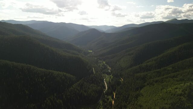 Aerial above Saint Joe Mountains in Idaho in summer at sunset