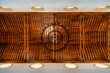 View from below of the chandelier and wooden ceiling of the Cathedral of Cartagena de Indias, Colombia