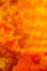 Red and yellow old rough wall in closeup